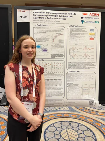 Rebecca Stinson with her poster at RehabWeek 2025